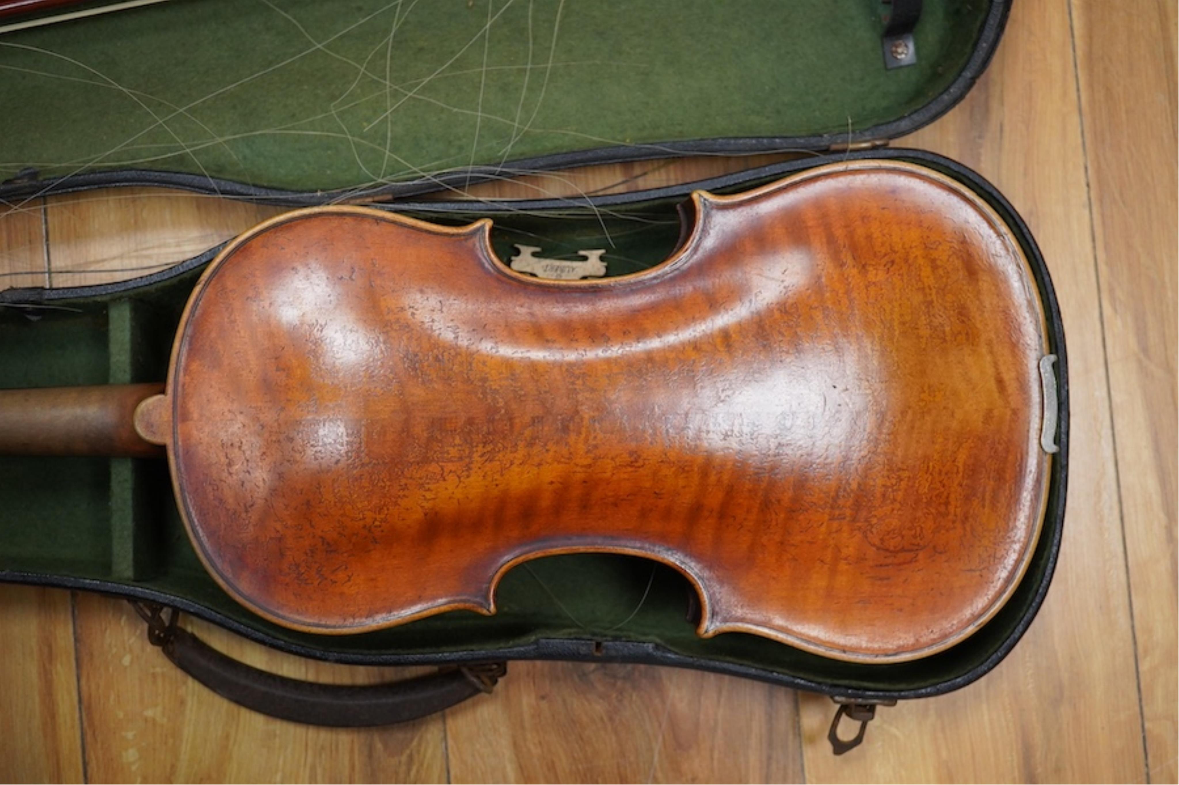 A late 19th cased century French unmarked violin and bow, body 35cm high.